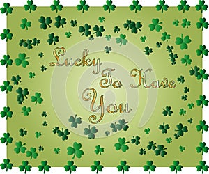 Saint Patrick's Day greeting card with sparkled green clover leaves and text. Inscription - Lucky To Have You