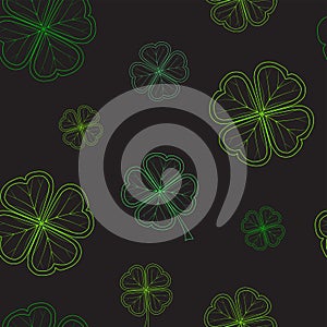 Saint Patrick`s Day seamless pattern with green tender clover leaves on black background.