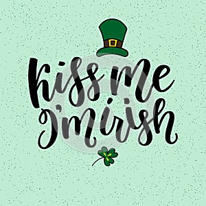 Saint Patricks Day greeting card with sparkled green clover leaves and text. Inscription - Kiss Me, I am Irish. St photo