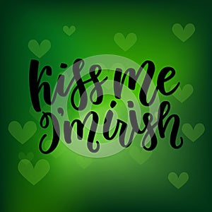 Saint Patricks Day greeting card with sparkled green clover leaves and text. Inscription - Kiss Me, I am Irish. St photo