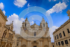 Saint Paul and Peter Cathedral in Mdina, Malta. Roman Catholic church under cloudy sky background.