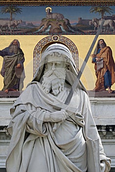 Saint Paul statue in front of the basilica of Saint Paul Outside the Walls, Rome, Italy