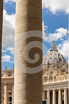 Saint Peter`s Dome seen through the Bernini Colonnade in St. Peter`s Square, Doric column detail.