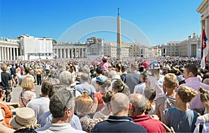 Saint Peter's Square full of people and tourist waiting for pope Francis.