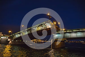 Saint Petersburg, bridging of bridge at night, drawbridge on Neva river at White nights
