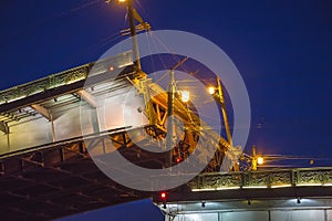 Saint Petersburg, bridging of bridge at night, drawbridge on Neva river at White nights