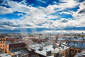 Saint Petersburg panorama, view from roof in the center of old city or downtown, dramatic sky, roofs of houses, horizon