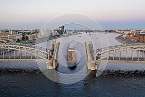 Saint Petersburg. Russia. Bolsheokhtinsky bridge lifted. Bridge of Peter the Great at sunset. The drawbridges of Petersburg.