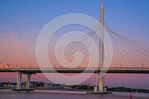 SAINT PETERSBURG, RUSSIA - MARCH 23, 2024: Cable-stayed bridge against the sunset