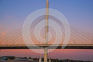 SAINT PETERSBURG, RUSSIA - MARCH 23, 2024: Cable-stayed bridge against the sunset