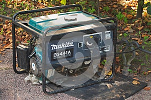 Saint Petersburg, Russia - September 08, 2018: Portable electric generator Makita for the supply of children`s attractions in the