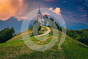 Saint Primoz mountain church at sunset, near Jamnik, Slovenia