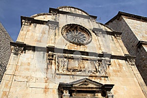 Saint Saviour Church, rose window, Latin inscription, and stone-carved decorations of the facade, Dubrovnik, Croatia