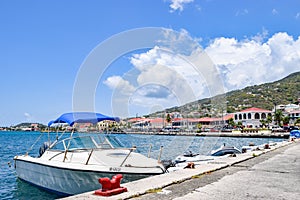 Saint Thomas, US Virgin Islands - April 01 2014: Sailboat and speedboats docked in Saint Thomas