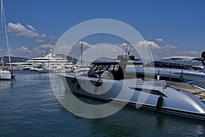 Saint-Tropez, France - August 8, 2022 - luxury yachts, boats, and sailboats line the port marina