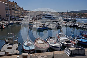 Saint-Tropez, France - August 8, 2022 - luxury yachts, boats, and sailboats line the port marina