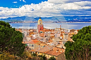 Saint Tropez village church tower and old rooftops view photo