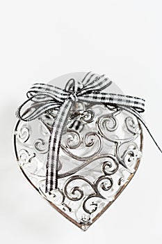 Saint Valentine day greeting card, beautiful silver heart with ribbon on white