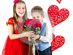 Saint Valentine`s day. Pretty girl with red dress and gentleman boy with blue vest, red butterfly tie, red roses bucket and heart