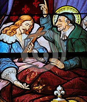 Saint Vincent de Paul on a Stained Glass in Paris photo