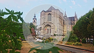 Saint Waltrude Collegiate Church of Mons, Wallonia, Belgium. View of west facade and sculpture
