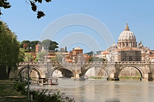 The SaintAngel bridge and St. Peter`s Basilica , Rome, Italy