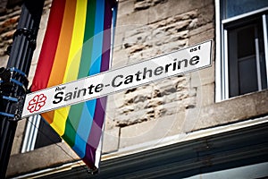 Sainte Catherine street sign and a rainbow gay pride flag