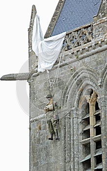 Sainte-Mere-Eglise, FRA, France - August 21, 2022: DDAY Memorial with Paratrooper on bell tower