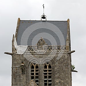 Sainte-Mere-Eglise, FRA, France - August 21, 2022: DDAY Memorial with Paratrooper on bell tower