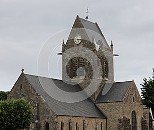 Sainte-Mere-Eglise, FRA, France - August 21, 2022: DDAY Memorial with Paratrooper on bell tower