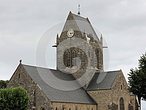 Sainte-Mere-Eglise,FRA,France - August 21, 2022: DDAY Memorial with Paratrooper on bell tower