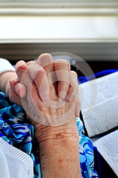 Saintly Hands and Bible
