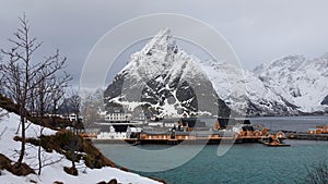 Sakrisoy island and Olstinden mountain at the Reinefjorden on the Lofoten in Norway in winter