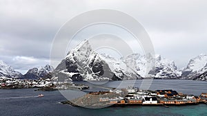 Sakrisoy island and Olstinden mountain at the Reinefjorden on the Lofoten in Norway in winter