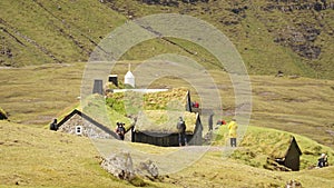 Saksun Village and beach in green landscape on the Faroe Islands in Denmark.