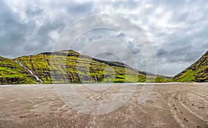 Saksun village, lake, waterfalls and sand in Faroe Islands