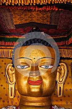 Sakyamuni Buddha statue face close up photo