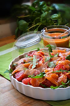 Salad with arugula, grapefruit and smoked salmon, a fresh summer meal for the cold buffet