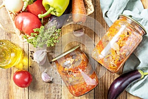 Salad with aubergines and vegetables on a rustic table.