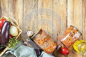 Salad with aubergines and vegetables on a rustic table.