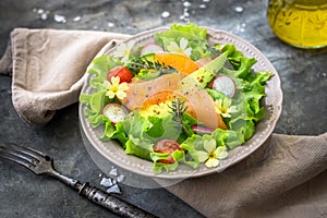 Salad with avocado and smoked salmon