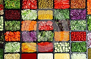 Salad bar with different fresh ingredients as background, top view