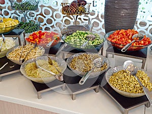 Salad bar with fresh organic vegetables in the restaurant