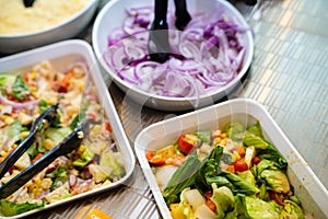 Salad bar. Salad buffet at restaurant. Fresh salad bar buffet for lunch. Healthy eating. Vegetable salad in bowl on counter.