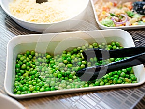 Salad bar. Salad buffet at restaurant. Fresh salad bar buffet for lunch. Healthy eating. Vegetable salad in bowl on counter.