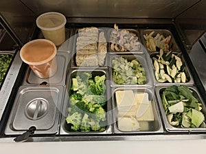 A salad bar and sauces stainles steel trays - image photo