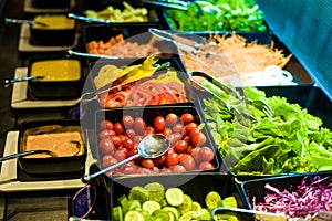 Salad bar with vegetables in the restaurant