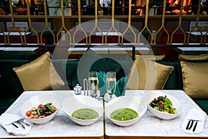 Salad with basil tomatoes and olives beef and nut sauce and Broccoli cream soup. Spinach soup