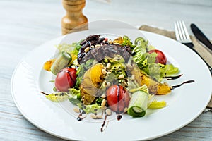 Salad with beef liver and citrus fruits