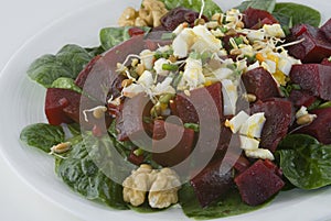 Salad with beets, boiled egg, and bean sprouts